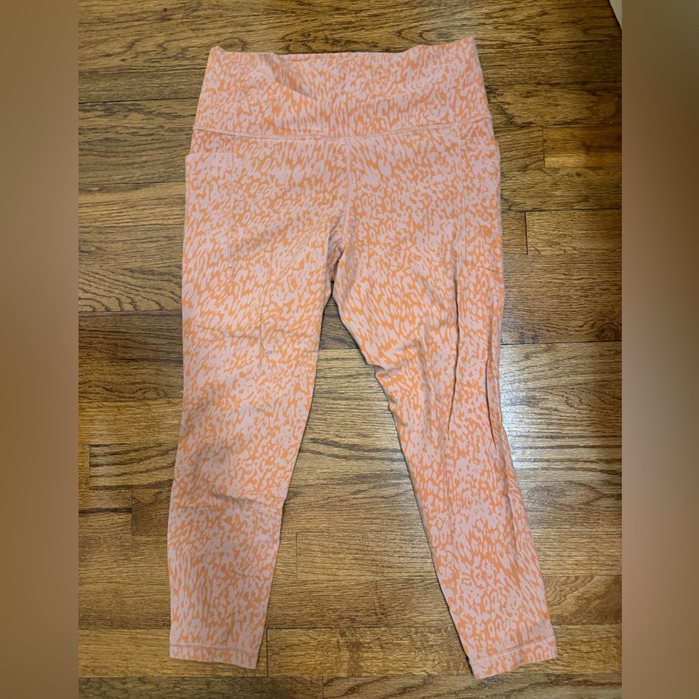 Athleta Salutation Stash Pocket II Printed 7/8 Tights Ocelot Spot Orange